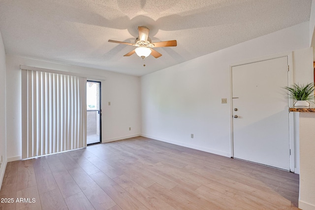 5757 W Eugie Ave Unit 2068, Glendale, AZ 85304 - spare room featuring ceiling fan, light wood-type flooring, a textured ceiling, and baseboards