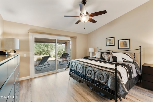 bedroom with access to exterior, light hardwood / wood-style floors, lofted ceiling, and ceiling fan