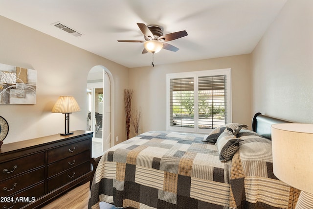 bedroom featuring light hardwood / wood-style floors and ceiling fan