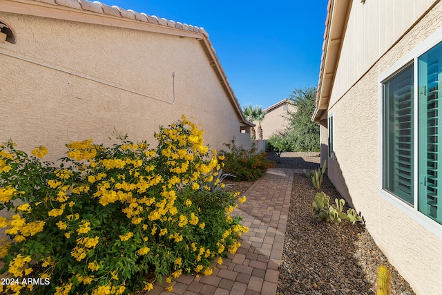 view of side of property with a patio area