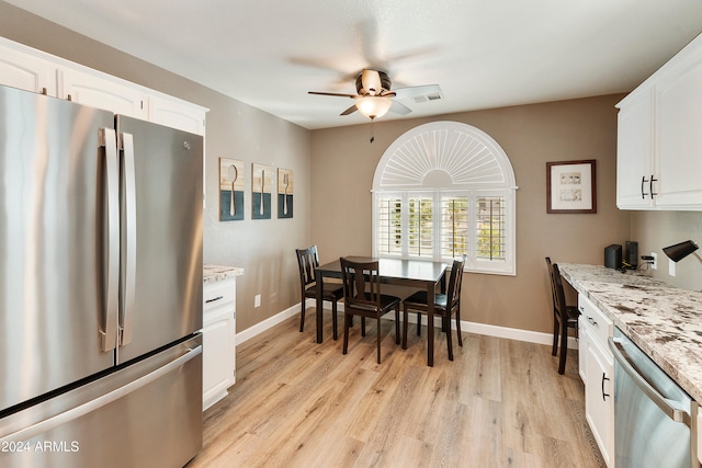 dining space featuring light hardwood / wood-style floors and ceiling fan