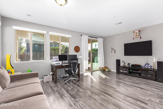 office space with wood-type flooring