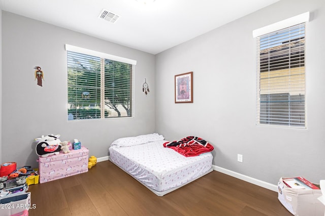 bedroom featuring dark hardwood / wood-style flooring