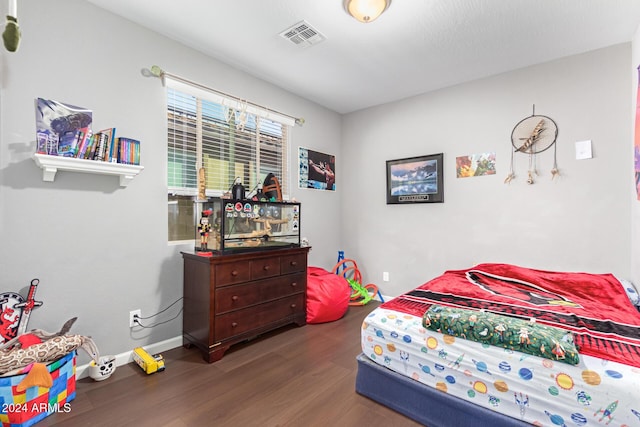 bedroom featuring dark wood-type flooring