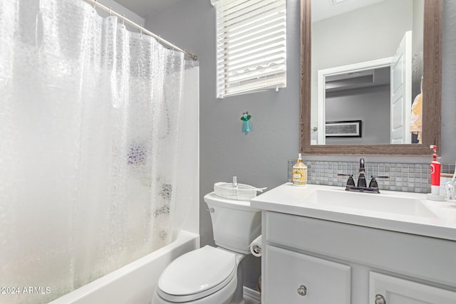 full bathroom with vanity, toilet, decorative backsplash, and shower / bath combo