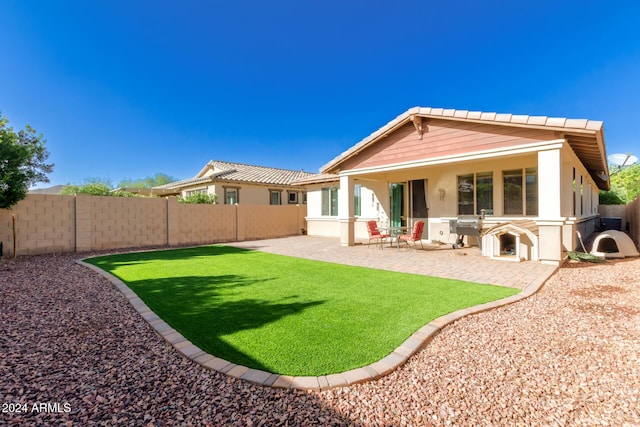 rear view of house with a patio area