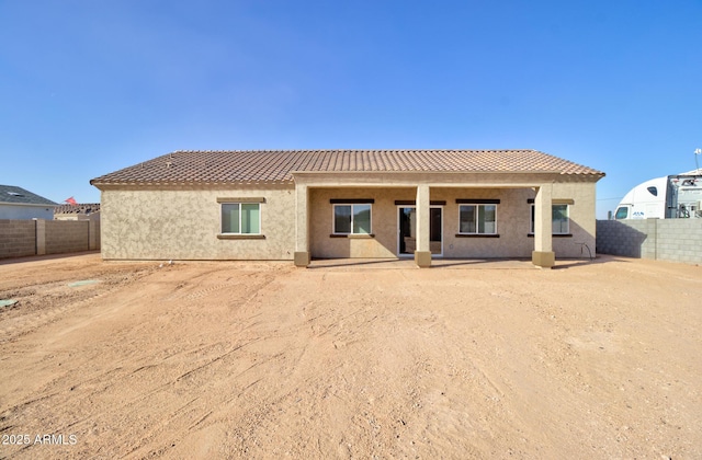 rear view of property featuring a patio area