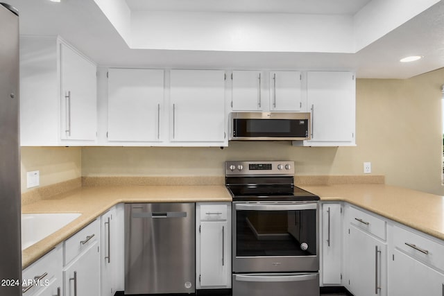 kitchen with white cabinetry, sink, and appliances with stainless steel finishes