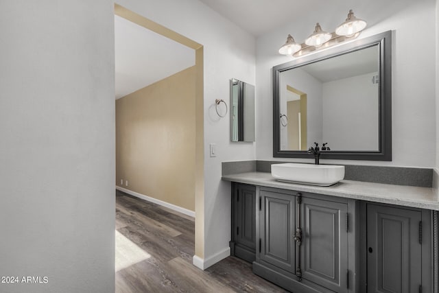 bathroom featuring vanity and hardwood / wood-style flooring