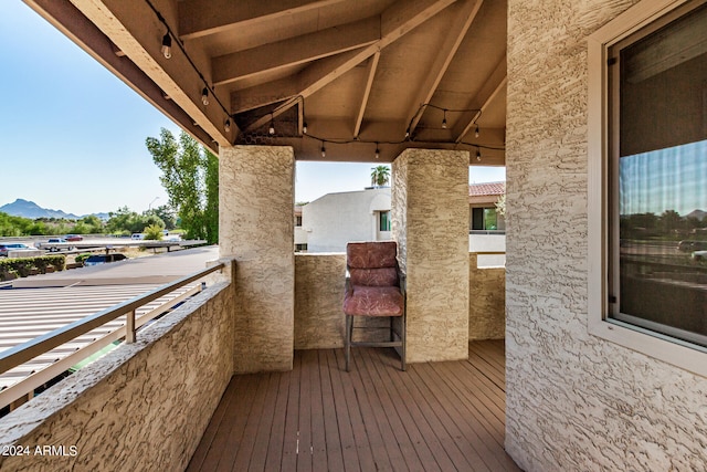 wooden deck featuring a mountain view