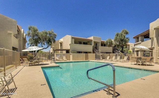 view of pool featuring a patio