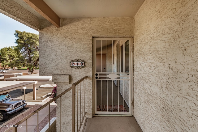 doorway to property with a balcony