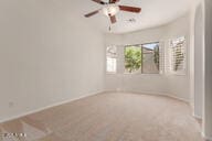 16813 S 30th Ave, Phoenix, AZ 85045 - spare room featuring a ceiling fan and baseboards
