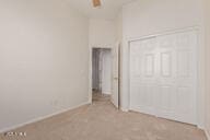 16813 S 30th Ave, Phoenix, AZ 85045 - unfurnished bedroom featuring baseboards and light colored carpet