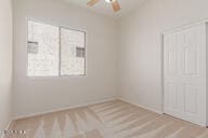 16813 S 30th Ave, Phoenix, AZ 85045 - spare room featuring a ceiling fan and baseboards