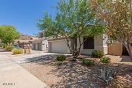 16813 S 30th Ave, Phoenix, AZ 85045 - view of front facade with a garage and driveway