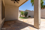 16813 S 30th Ave, Phoenix, AZ 85045 - fenced backyard with a patio area and a ceiling fan