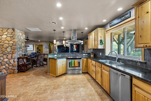 kitchen featuring stainless steel appliances, kitchen peninsula, sink, hanging light fixtures, and island exhaust hood