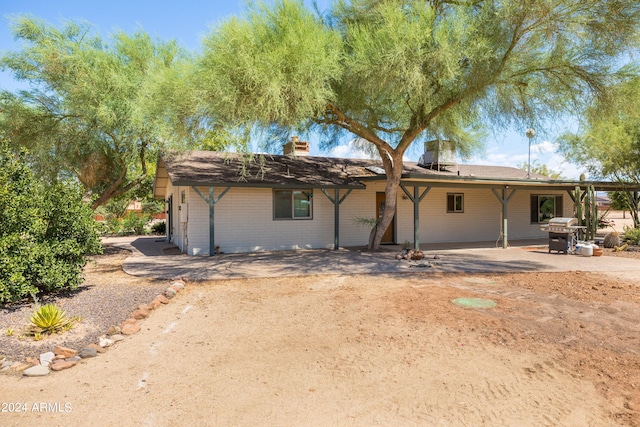 view of front of home with a patio area