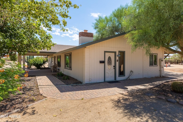 ranch-style home with a patio area