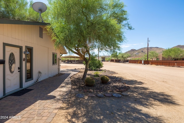 view of yard featuring a mountain view and a patio area