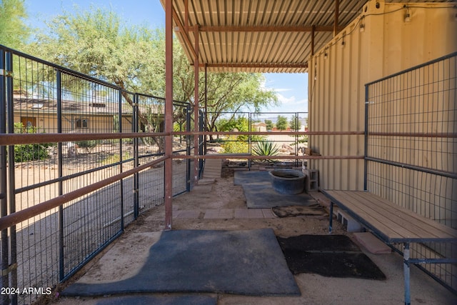 view of patio featuring an outbuilding