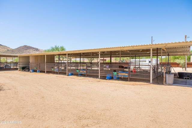 view of stable with a mountain view