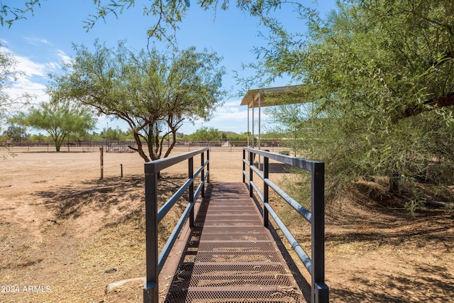 view of dock with a rural view