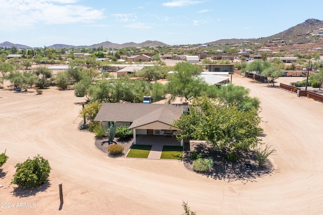 birds eye view of property with a mountain view