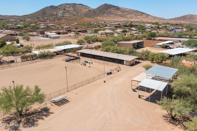 birds eye view of property with a mountain view