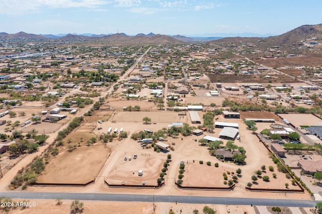 birds eye view of property with a mountain view