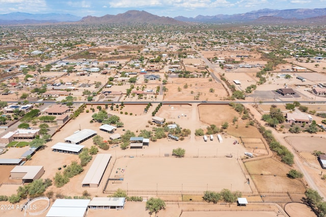 birds eye view of property with a mountain view