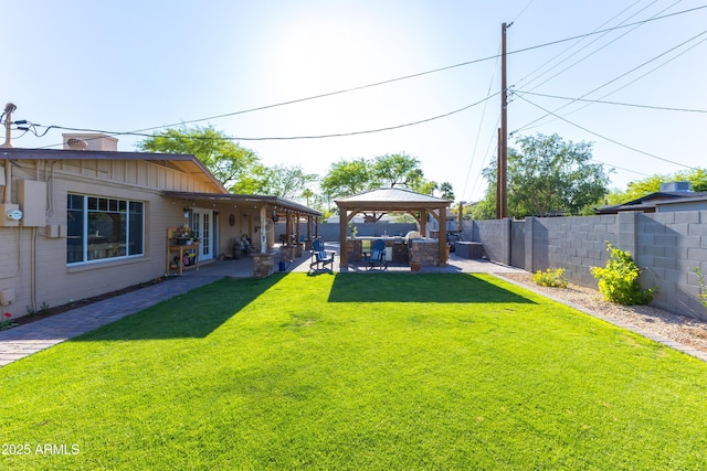 view of yard with a fenced backyard, a patio, and a gazebo