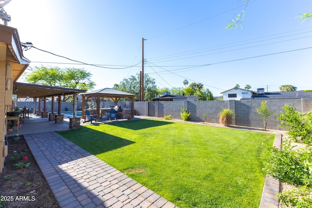 view of yard featuring a gazebo, a fenced backyard, and a patio area