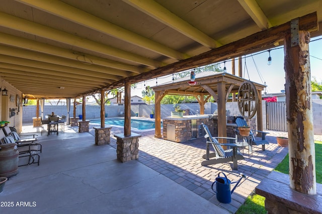 view of patio with a gazebo, a fenced backyard, a fenced in pool, and area for grilling