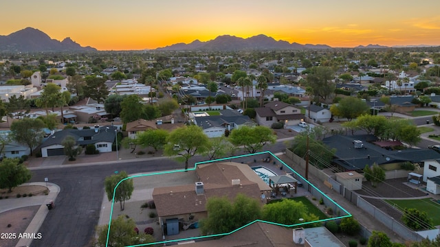birds eye view of property featuring a mountain view and a residential view