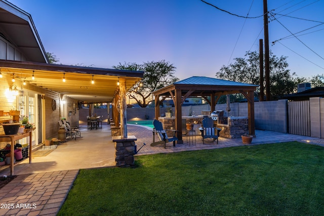 exterior space featuring a fenced backyard, a fenced in pool, a patio, and a gazebo