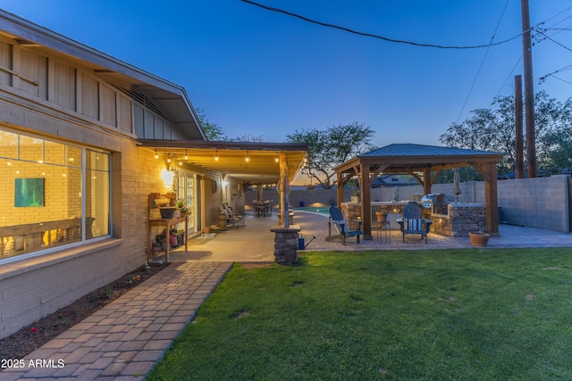 view of yard featuring a fenced backyard, a gazebo, and a patio area