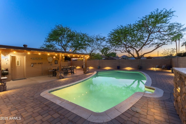 view of pool with a fenced backyard, a fenced in pool, and a patio