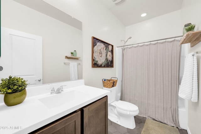 full bathroom featuring tile patterned floors, vanity, toilet, and shower / tub combo