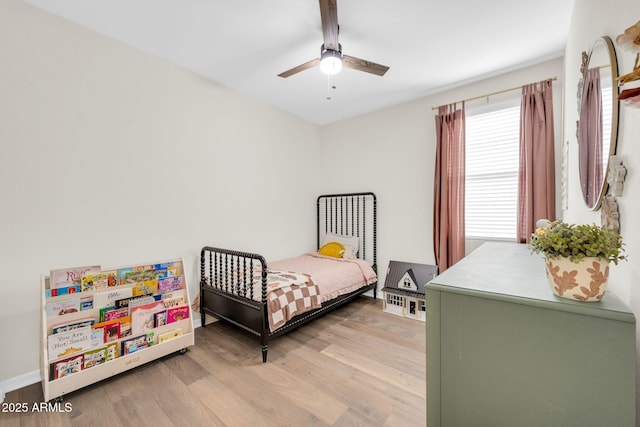 bedroom featuring wood-type flooring and ceiling fan