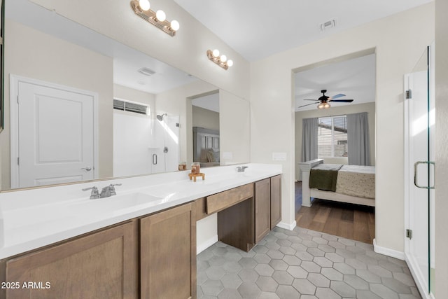 bathroom featuring ceiling fan, tile patterned floors, vanity, and a shower with shower door