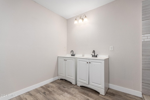 bathroom featuring vanity and wood-type flooring