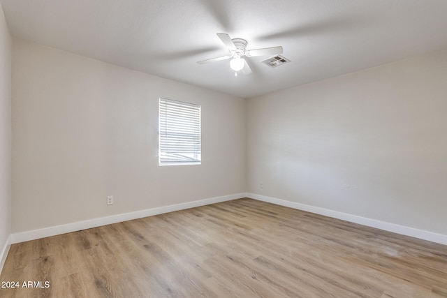 spare room featuring ceiling fan and light wood-type flooring