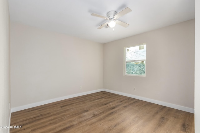 spare room with ceiling fan and hardwood / wood-style flooring