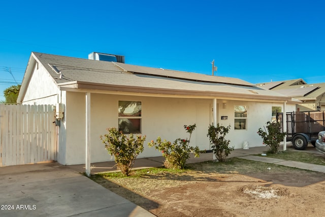 view of front of home featuring solar panels