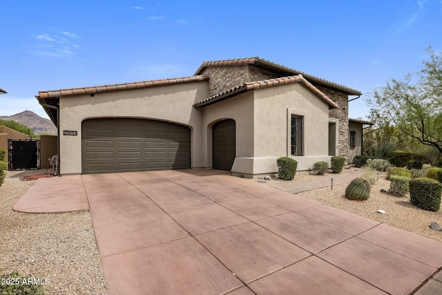 20055 N 96th Way, Scottsdale, AZ 85255 - mediterranean / spanish home featuring an attached garage, concrete driveway, stucco siding, a tiled roof, and a mountain view