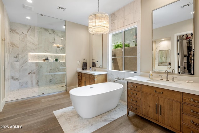 20055 N 96th Way, Scottsdale, AZ 85255 - full bath featuring a marble finish shower, two vanities, wood finished floors, and a soaking tub