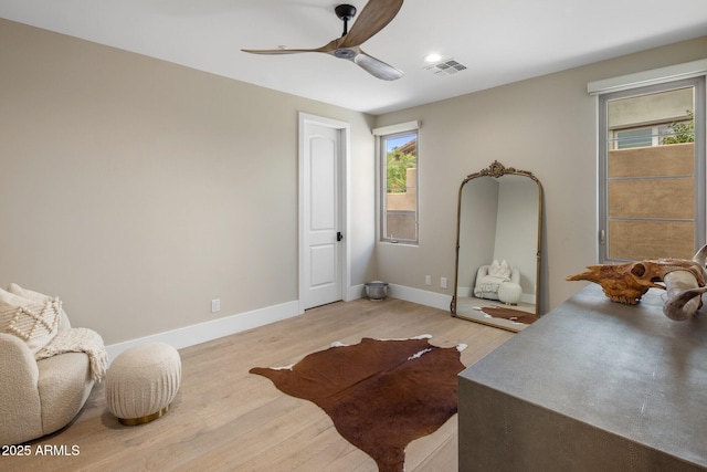 20055 N 96th Way, Scottsdale, AZ 85255 - living area featuring light wood finished floors, a ceiling fan, and baseboards