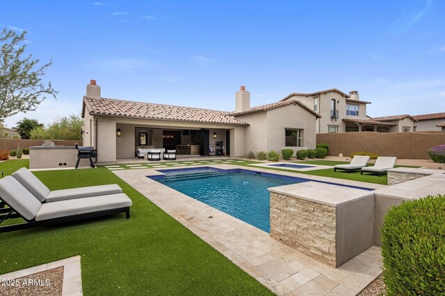 20055 N 96th Way, Scottsdale, AZ 85255 - view of pool featuring an in-ground hot tub, a patio area, an outdoor bar, and an outdoor kitchen